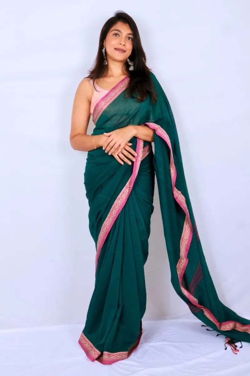 Green khadi cotton saree from Phulia handwoven with vibrant pink border and woven detailing Noolagam
