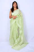 Mint green Chanderi Chikankari saree from Lucknow with white floral hand embroidery and detailed pallu Noolagam