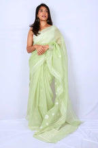 Mint green Chanderi Chikankari saree from Lucknow with white floral hand embroidery and detailed pallu Noolagam