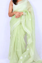 Mint green Chanderi Chikankari saree from Lucknow with white floral hand embroidery and detailed pallu Noolagam_2