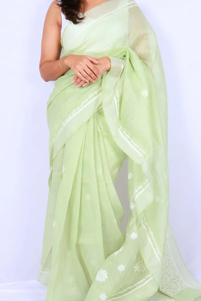 Mint green Chanderi Chikankari saree from Lucknow with white floral hand embroidery and detailed pallu Noolagam_2