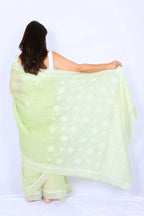 Mint green Chanderi Chikankari saree from Lucknow with white floral hand embroidery and detailed pallu Noolagam_4