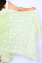 Mint green Chanderi Chikankari saree from Lucknow with white floral hand embroidery and detailed pallu Noolagam_5