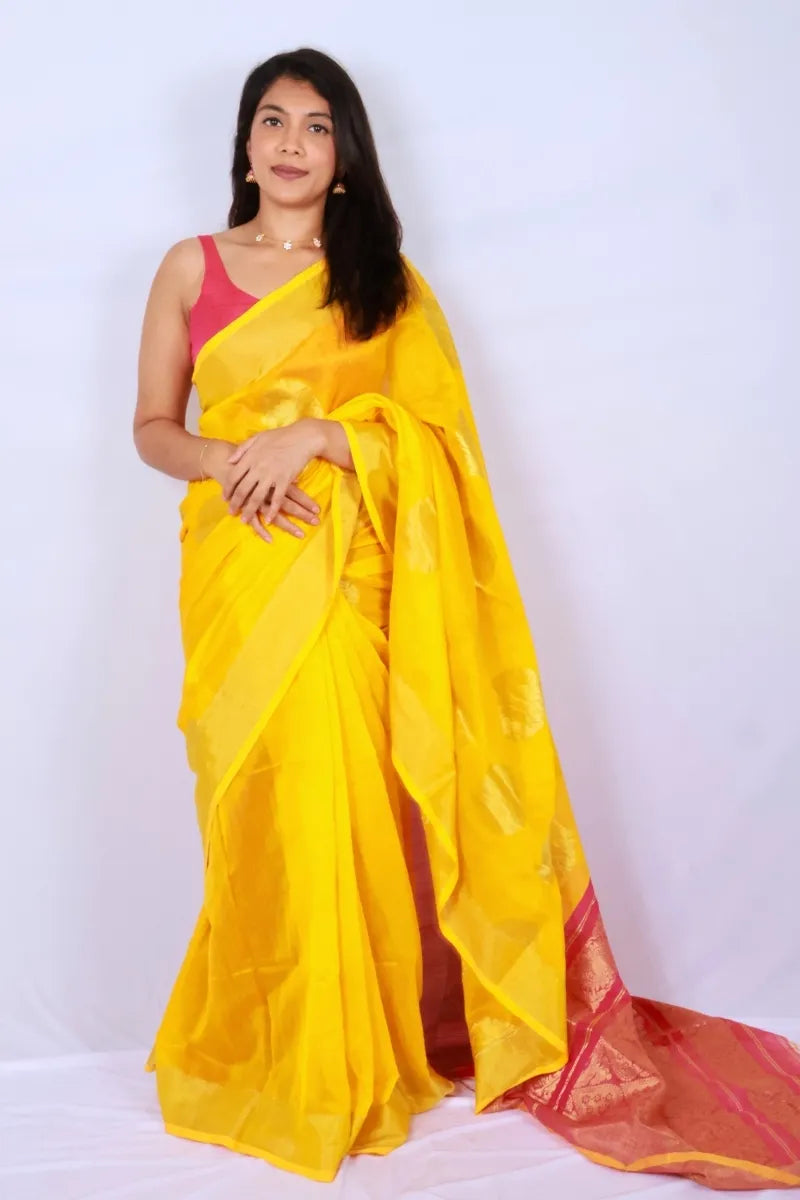 Yellow and pink Phulia handloom cotton saree with rich pink pallu and elegant woven detailing Noolagam