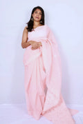 Baby pink cotton Chikankari saree from Lucknow with intricate white embroidered border and pallu Noolagam