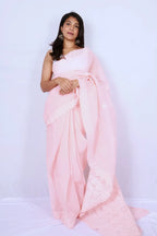 Baby pink cotton Chikankari saree from Lucknow with intricate white embroidered border and pallu Noolagam