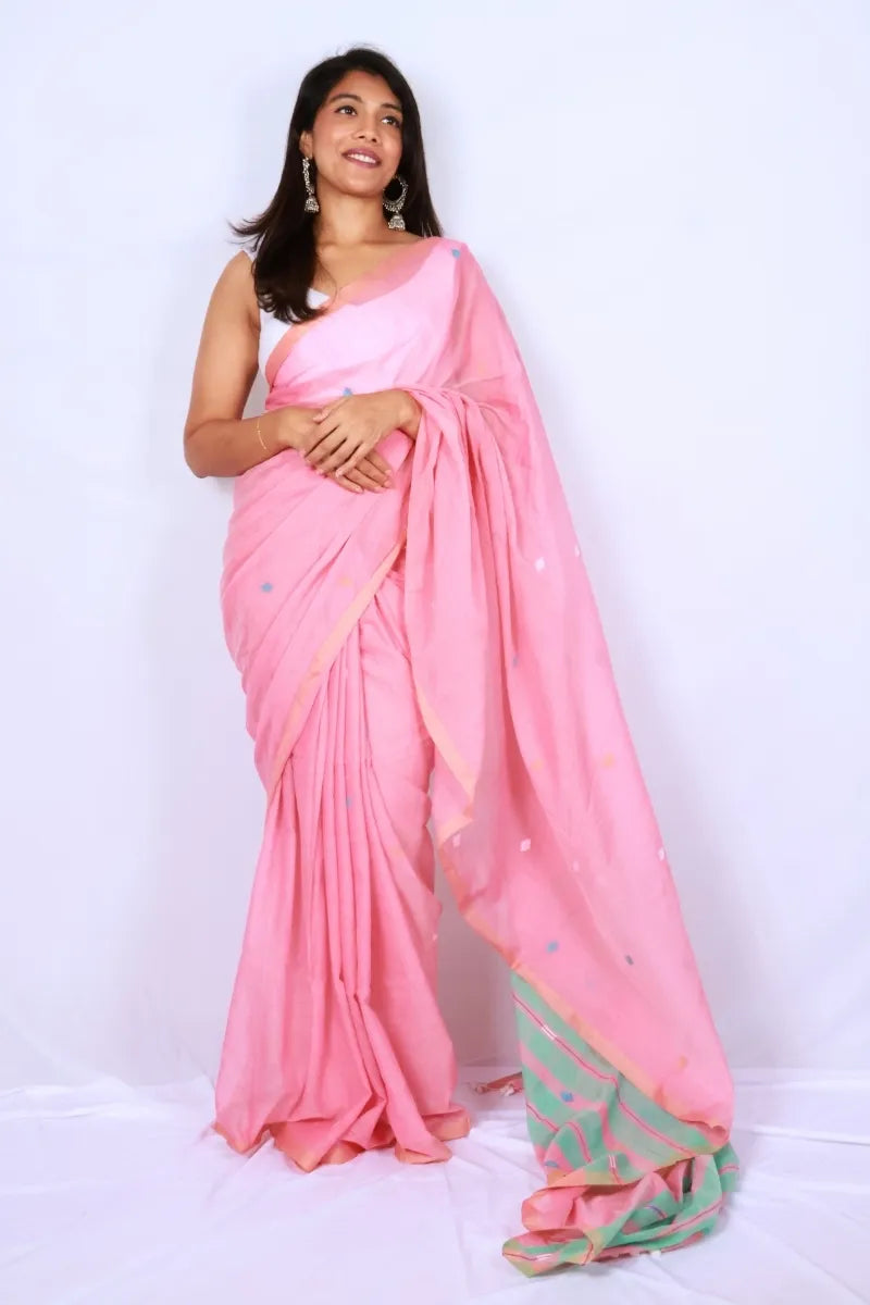Pink mul cotton saree from Phulia handwoven with mint green striped pallu and multicolour motifs Noolagam