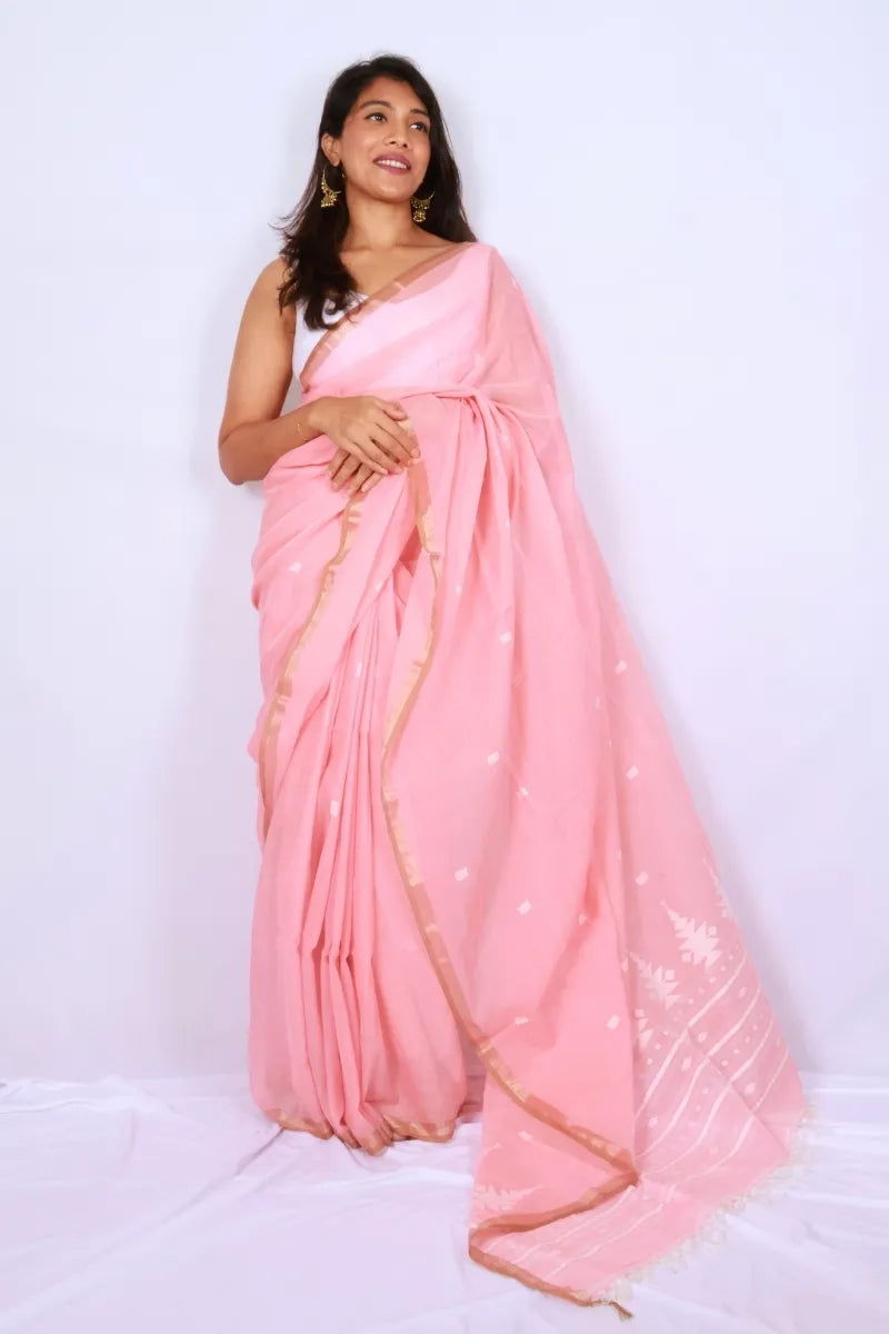Blush pink khadi cotton saree from Phulia handwoven with delicate white motifs and gold border Noolagam