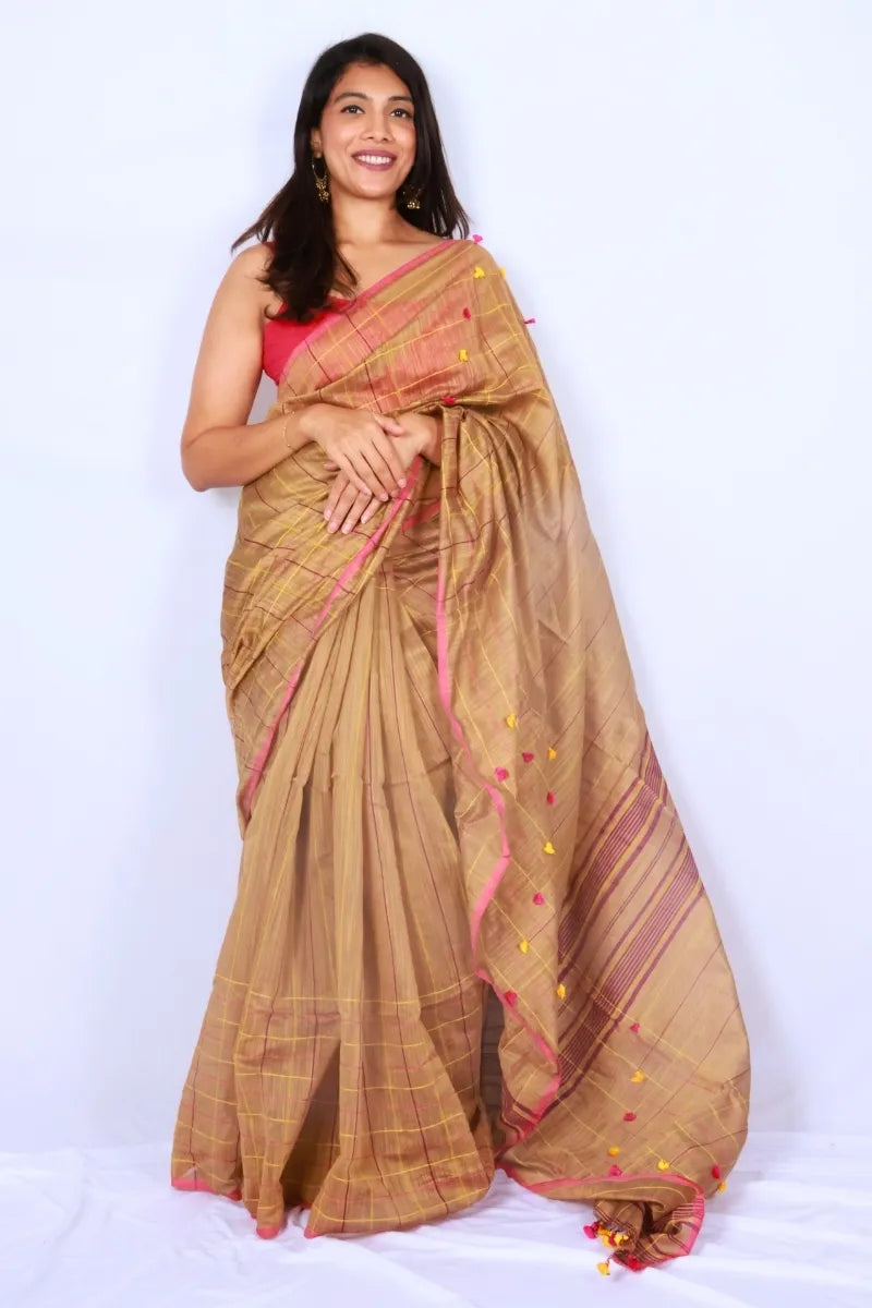 Gold brown and pink Phulia handloom slub cotton saree with fine check detailing and tassel embellishments Noolagam