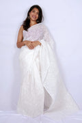 White Kota Chikankari saree from Lucknow with white-on-white hand embroidered floral and leaf motifs Noolagam