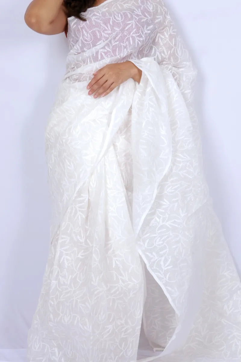 White Kota Chikankari saree from Lucknow with white-on-white hand embroidered floral and leaf motifs Noolagam_2
