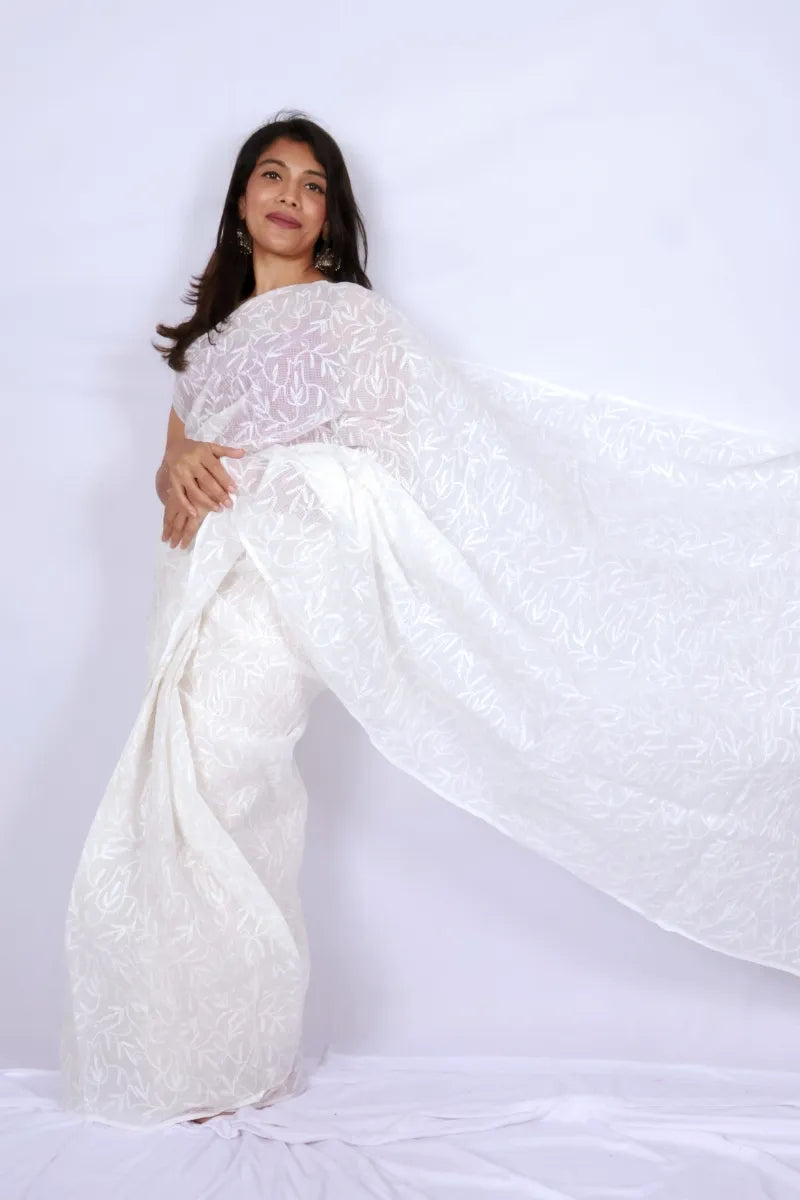 White Kota Chikankari saree from Lucknow with white-on-white hand embroidered floral and leaf motifs Noolagam_3