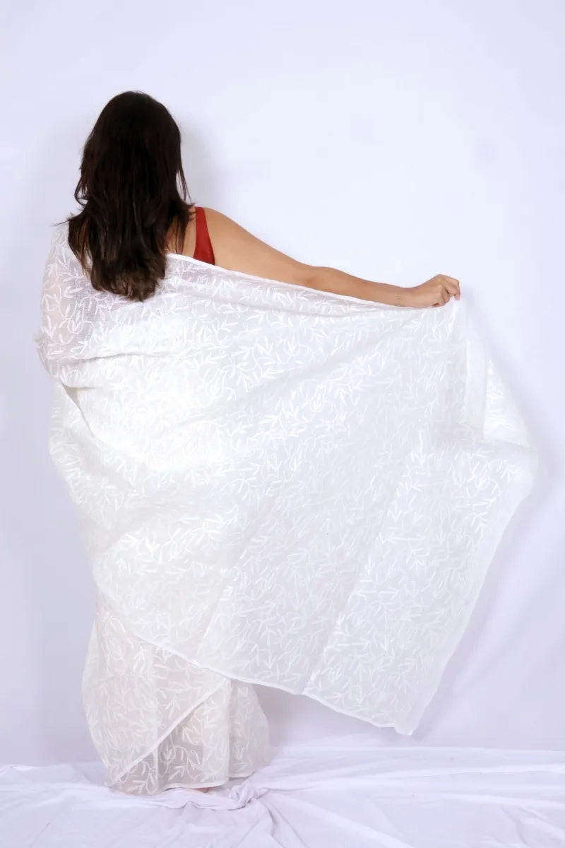 White Kota Chikankari saree from Lucknow with white-on-white hand embroidered floral and leaf motifs Noolagam_4