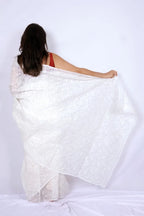 White Kota Chikankari saree from Lucknow with white-on-white hand embroidered floral and leaf motifs Noolagam_4
