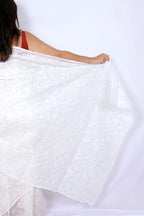 White Kota Chikankari saree from Lucknow with white-on-white hand embroidered floral and leaf motifs Noolagam_5
