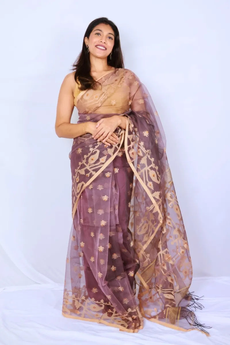Mauve Phulia muslin art silk Jamdani saree with intricate woven motifs and soft tassels Noolagam