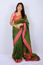Bottle green and pink Phulia handloom khadi cotton saree with vibrant pink border and patterned pallu Noolagam