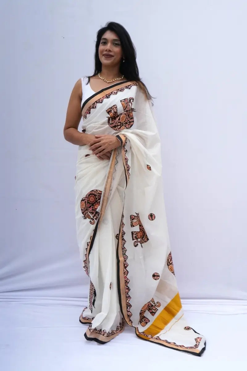 KeralakasavusareewithKalamkariappliqueinivoryblackandmustard_Noolagam